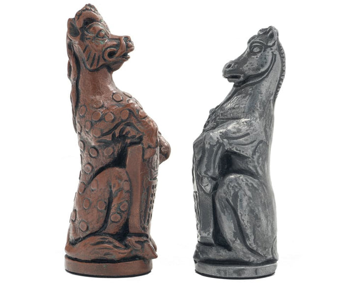 Chess pieces from the Berkeley Chess Royal Beast Metallic set featuring intricate carvings inspired by the Royal Beasts of Hampton Court Palace