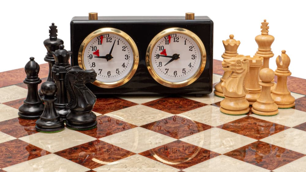 An image of one of our luxury chess sets, with pieces and a clock