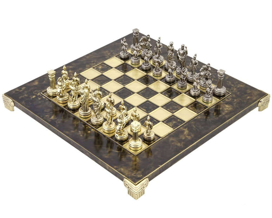 Manopoulos Greek Roman Army Metal Chess Set with Wooden Case featuring brass and nickel plated chess pieces on a detailed chess board.