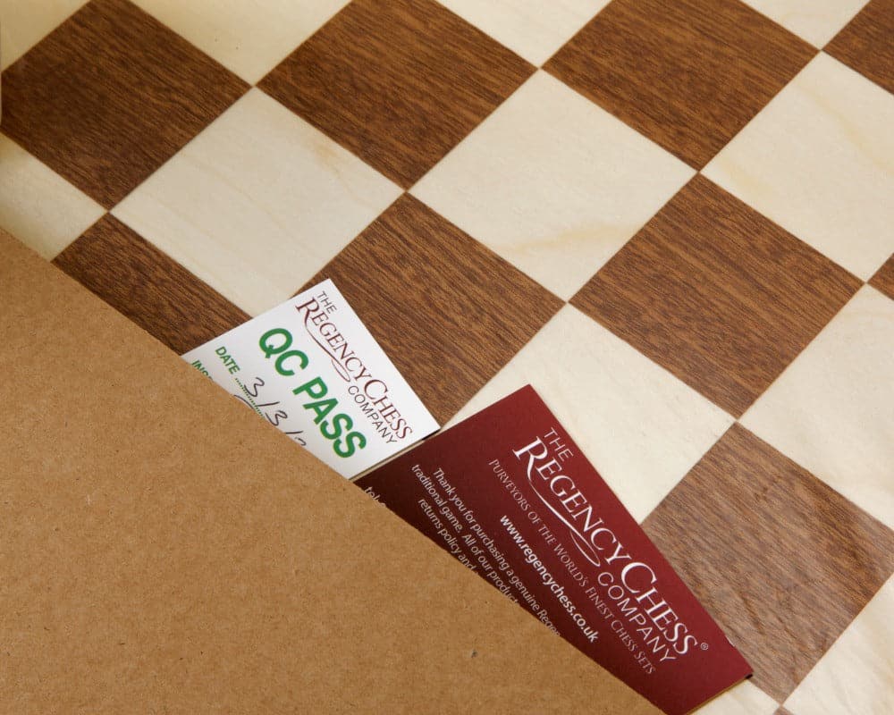 Quality assurance tags on a 19 inch inlaid mahogany chess board from The Regency Chess Company