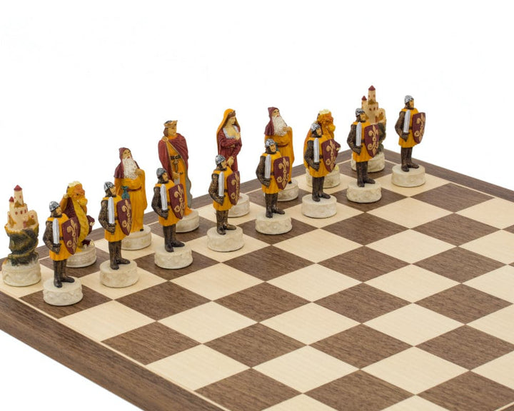 Medieval hand-painted chess pieces by Italfama on a chessboard, featuring exquisite detail, ideal for a 16-inch board.