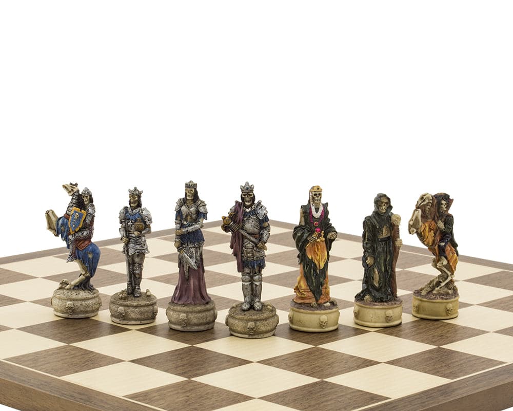 Hand-painted Zombie-themed chess pieces by Italfama on a chessboard, showcasing exquisite details and contrasting color schemes.