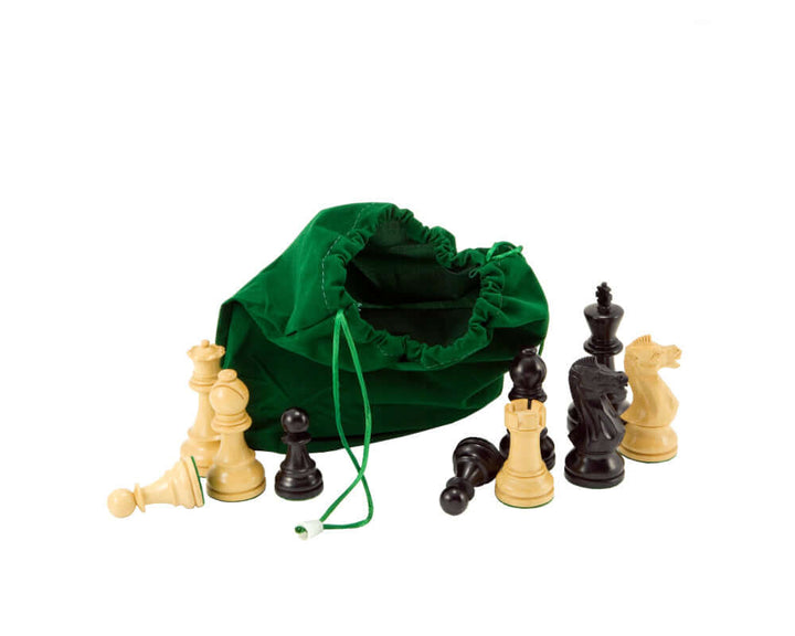 Green drawstring chess piece bag with scattered black and white chess pieces on white background