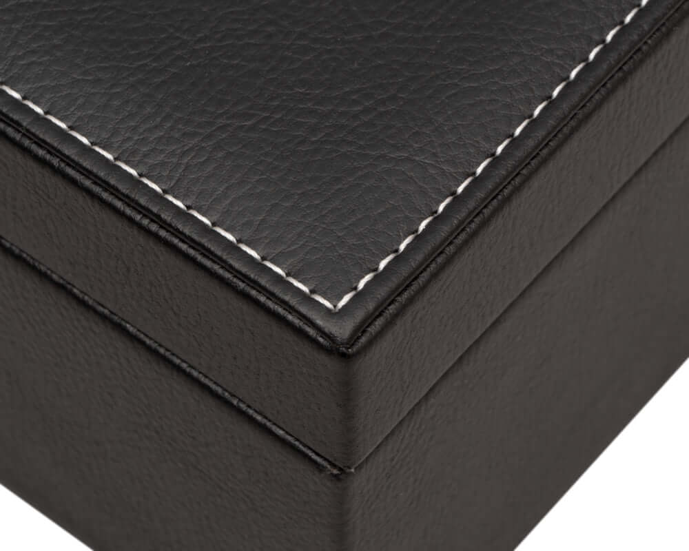 Black leatherette chess piece case corner with stitching detail.