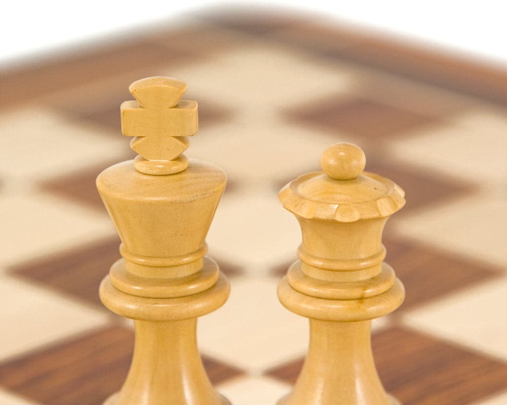 Sheesham and boxwood chess king and queen pieces from the French Knight Series on a chessboard