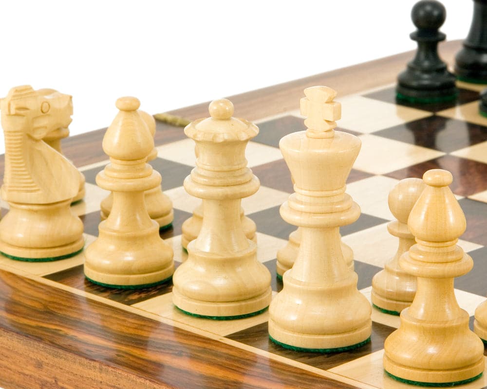 French Knight Series Ebonised Staunton Chess Pieces, expertly turned boxwood, classic design, close-up on wooden chessboard.