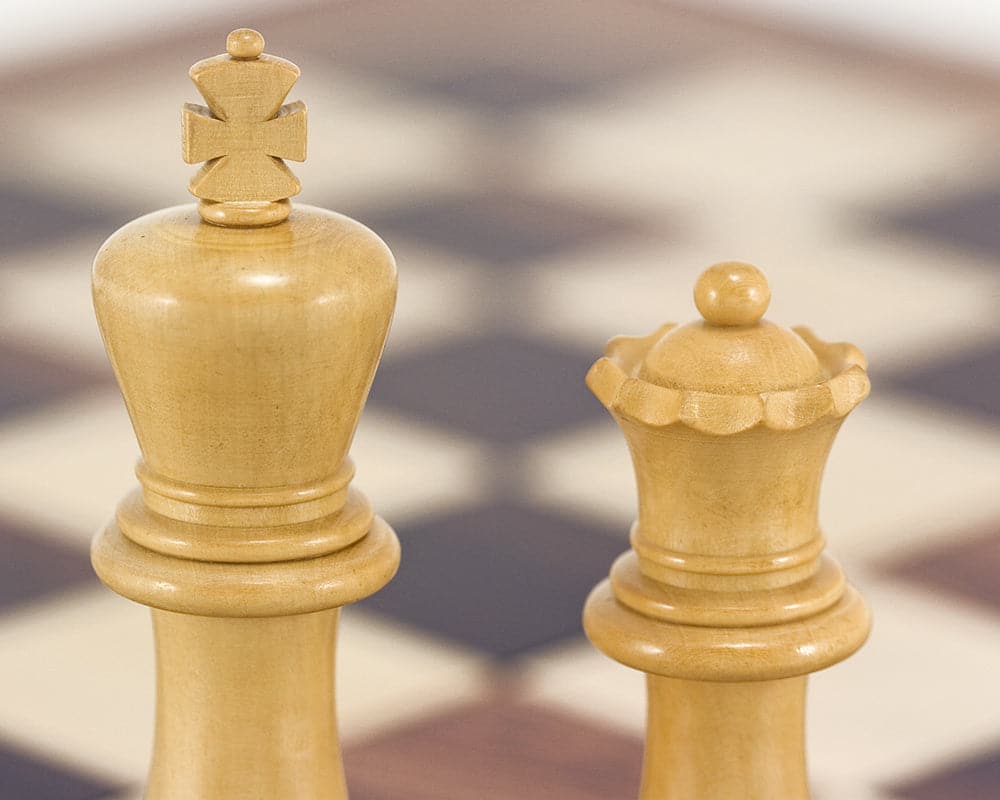 Rosewood Staunton chess king and queen pieces on chessboard