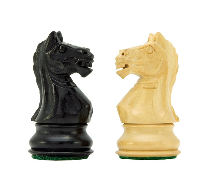 Ebonised and natural Boxwood Staunton Knight chess pieces with billiard cloth bases