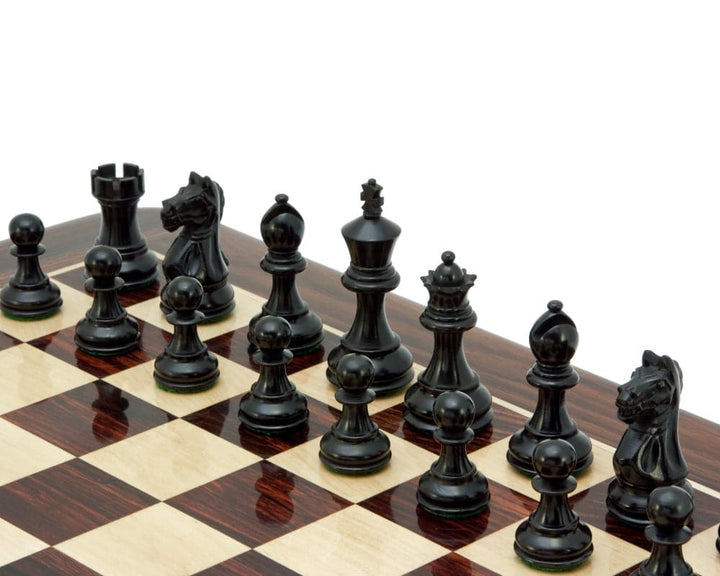 Ebonised Staunton chess pieces on a chess board with classic design and perfect balance.