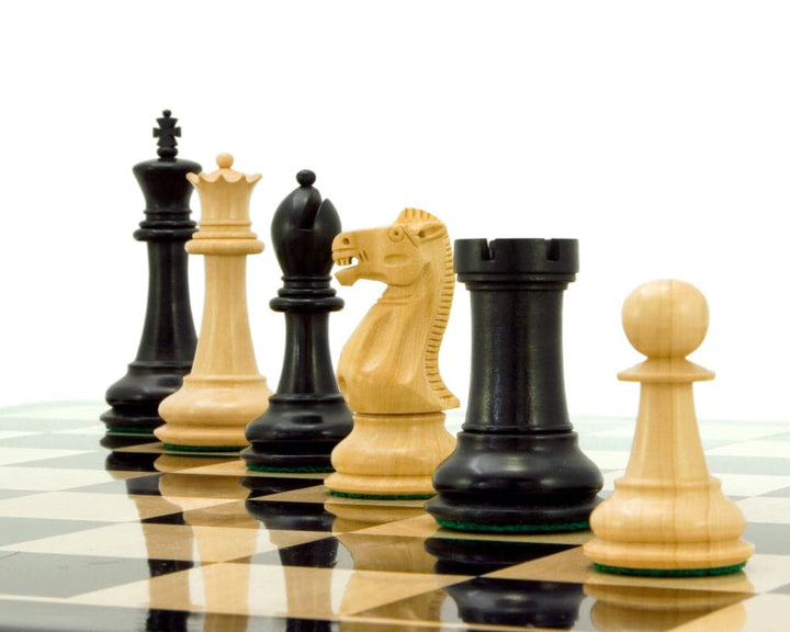 Victoria Series Ebonised Boxwood Chessmen with 3.75 inch king on board, showcasing superior craftsmanship and high value.