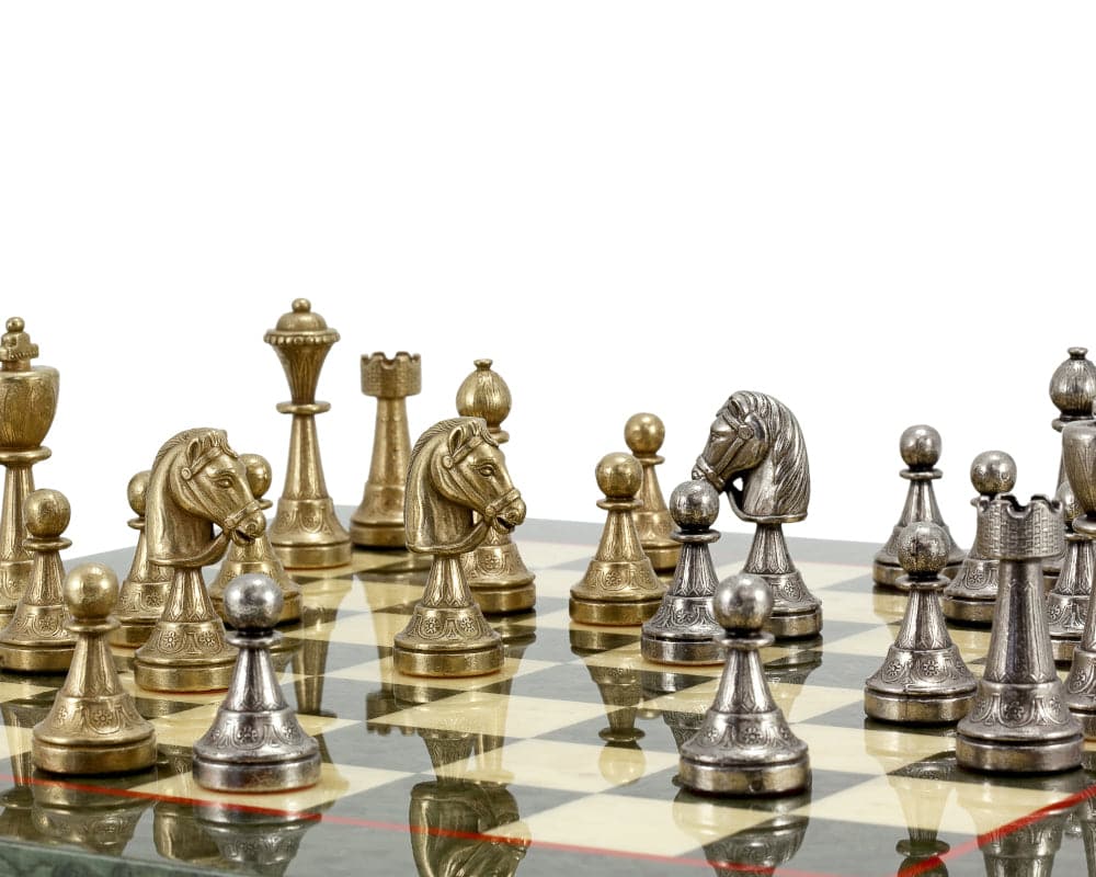 Finnesburg Series brass and nickel chess pieces on a chessboard with superb detail and perfect balance, 3 inch king.