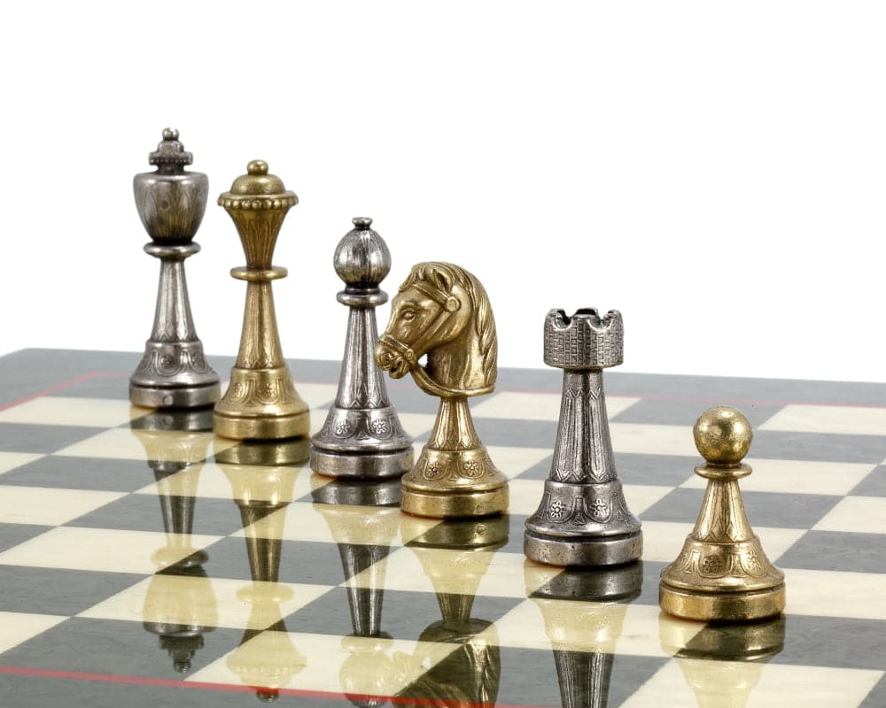 Finnesburg Series brass and nickel chess pieces on a board, hand-crafted by Italian artisans, featuring a 3-inch king for perfect balance