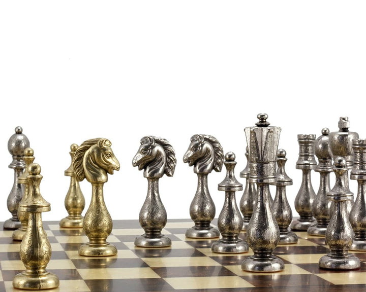 Maghreb Brass and Nickel Chess Pieces with intricate filigree detail on a chessboard, 4-inch king, crafted in Italy.