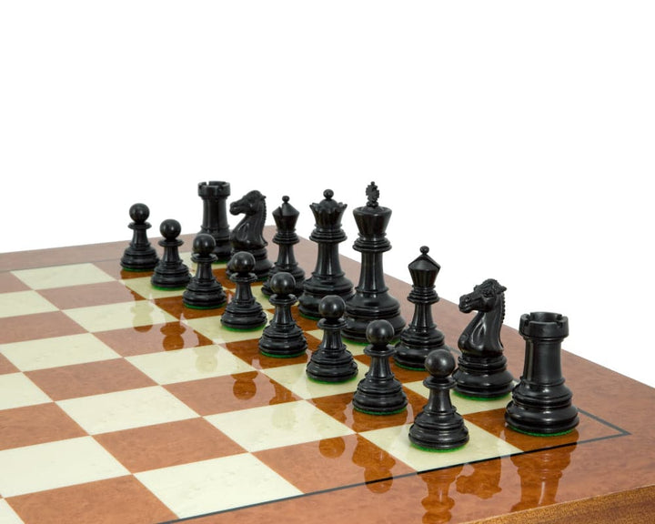 Handcrafted Cheltenham ebony and boxwood chess pieces on a 23 inch chessboard, featuring a 3.75 inch king and additional queens.