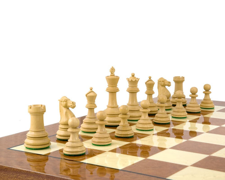 Handcrafted Cheltenham Series ebony and boxwood chess pieces set up on a 23-inch chessboard.