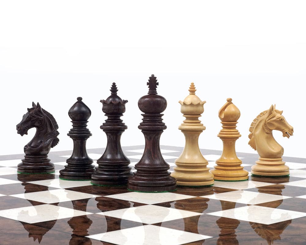 Hand-carved Luxury Staunton Garvi 4.25-inch Rosewood Chessmen set on a chessboard.