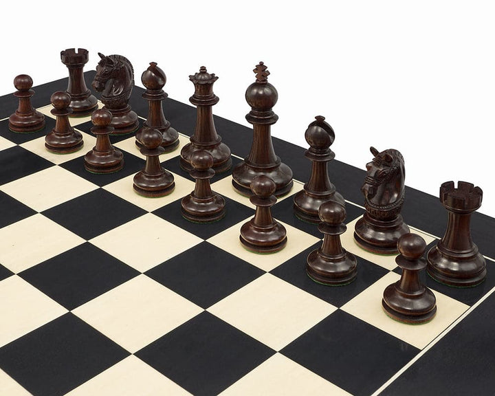 The La Valletta Redwood Chessmen set on a black and white chessboard, featuring detailed knights and a 4.5 inch king, crafted from solid redwood