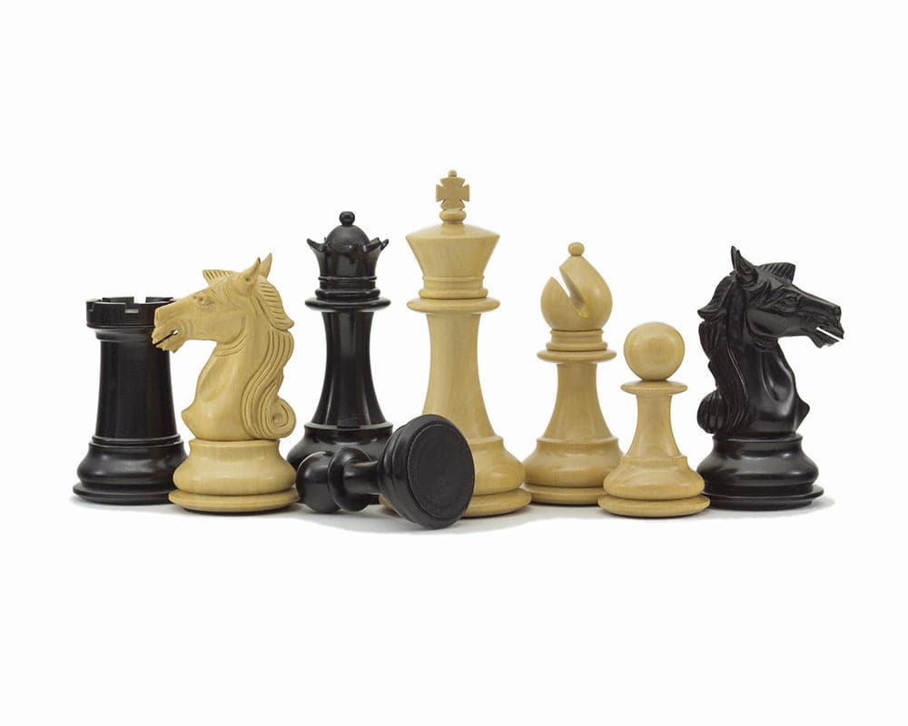 Columbus Series Chessmen Ebony 4" Staunton design set with ornate pieces handcrafted from ebony and boxwood, including an imperious 4-inch King.