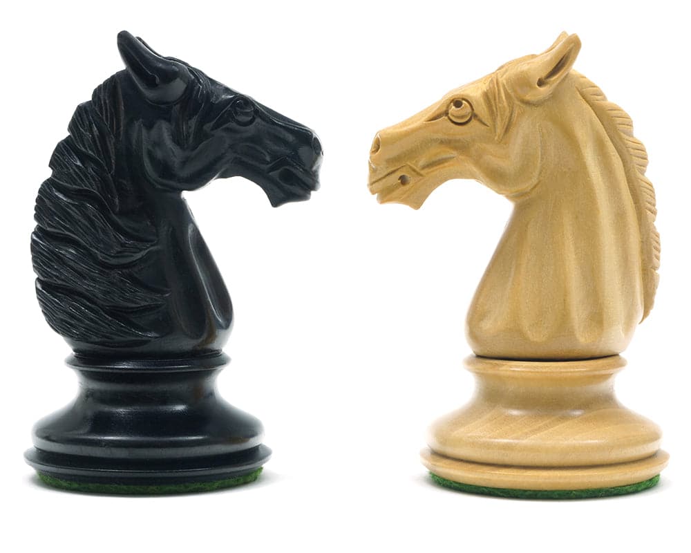 Hand-carved ebony and boxwood knight chess pieces from Traditional Staunton Ebony Bath Chessmen set.