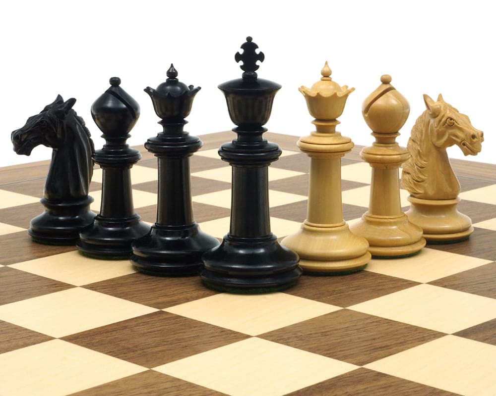 Traditional Staunton ebony and boxwood chessmen set on chessboard with detailed luxurious pieces including 3.75 inch kings