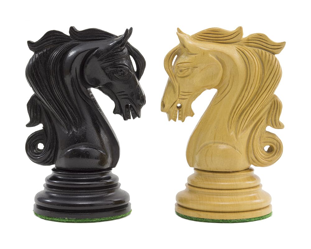 Intricately carved ebony and boxwood knights from The Kingsgate Ebony Chessmen set, showcasing exquisite detail and craftsmanship.