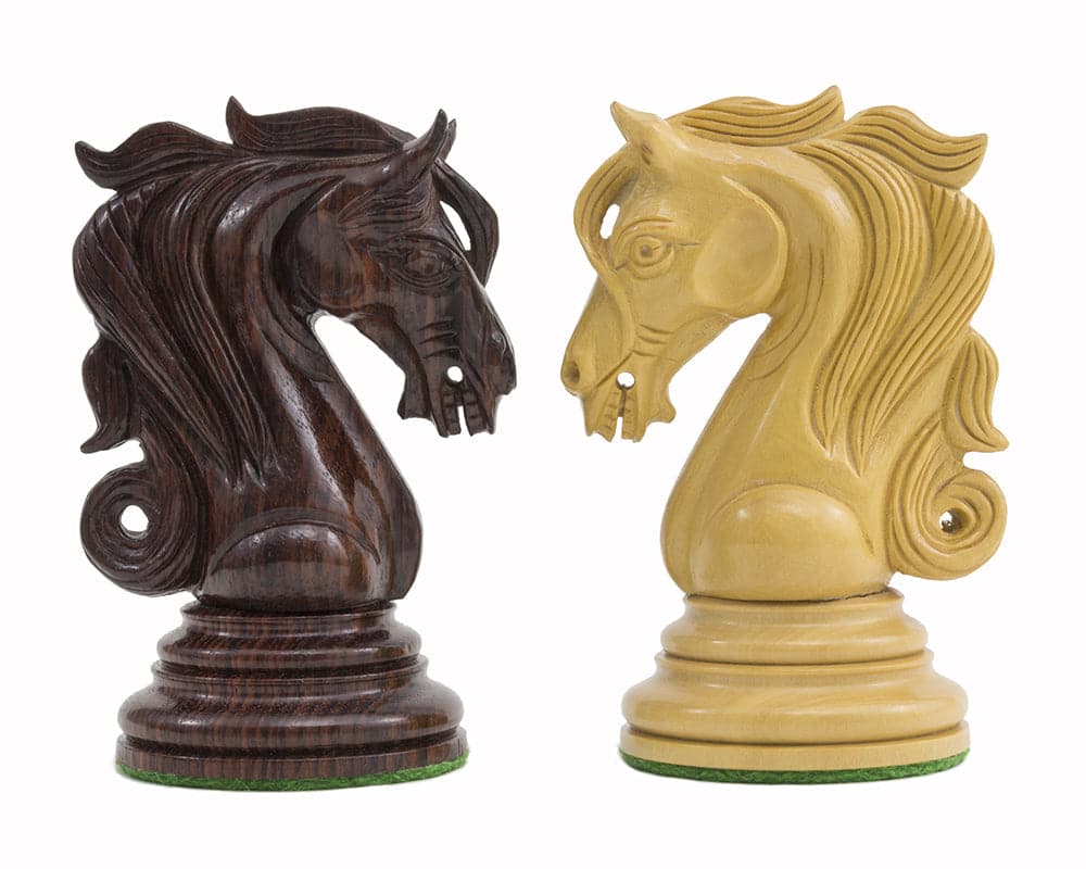 Ornate handcrafted rosewood knights from The Kingsgate Rosewood Chessmen set showing intricate carving details and billiard cloth bases