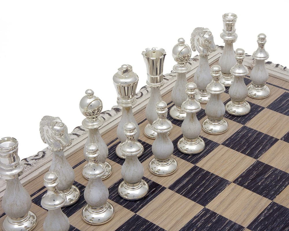 Luxurious 24 carat gold and 990 silver plated chess pieces on a decorative chessboard.