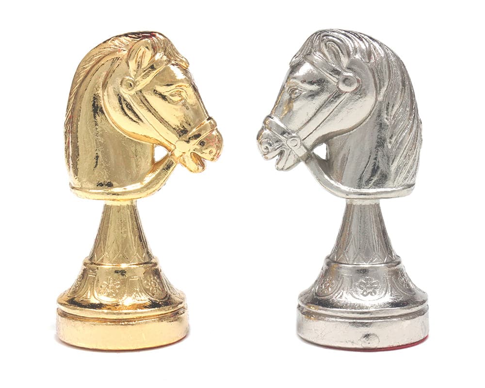 Gold and silver plated Italian chessmen knights with exquisite detail and weighted bases, perfect for luxury chess boards.