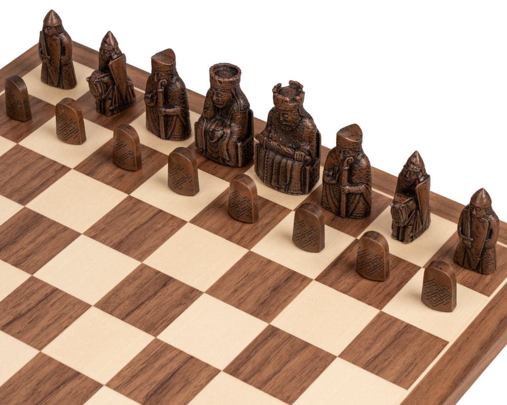 Medium-size Isle of Lewis chessmen set on a wooden chessboard