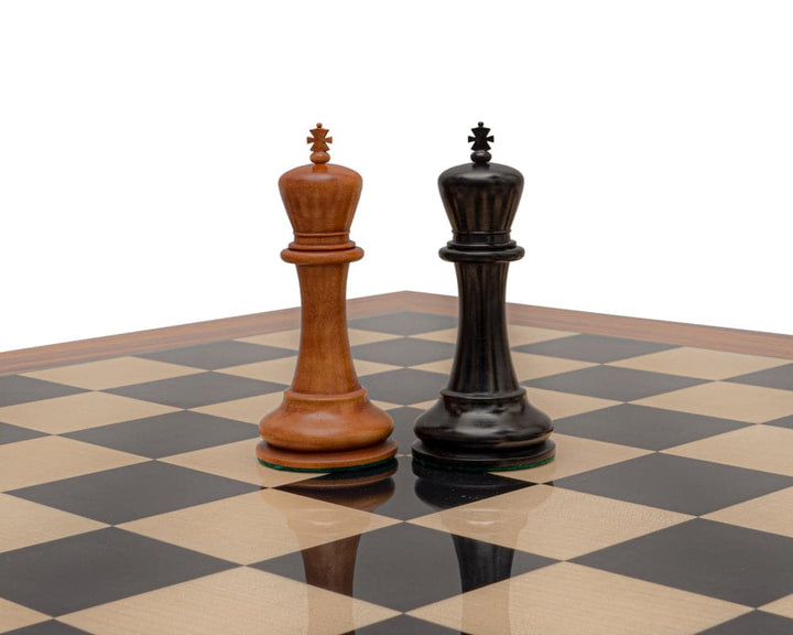 Reproduction Staunton Chessmen 1849 King pieces in antiqued boxwood and ebony on chessboard