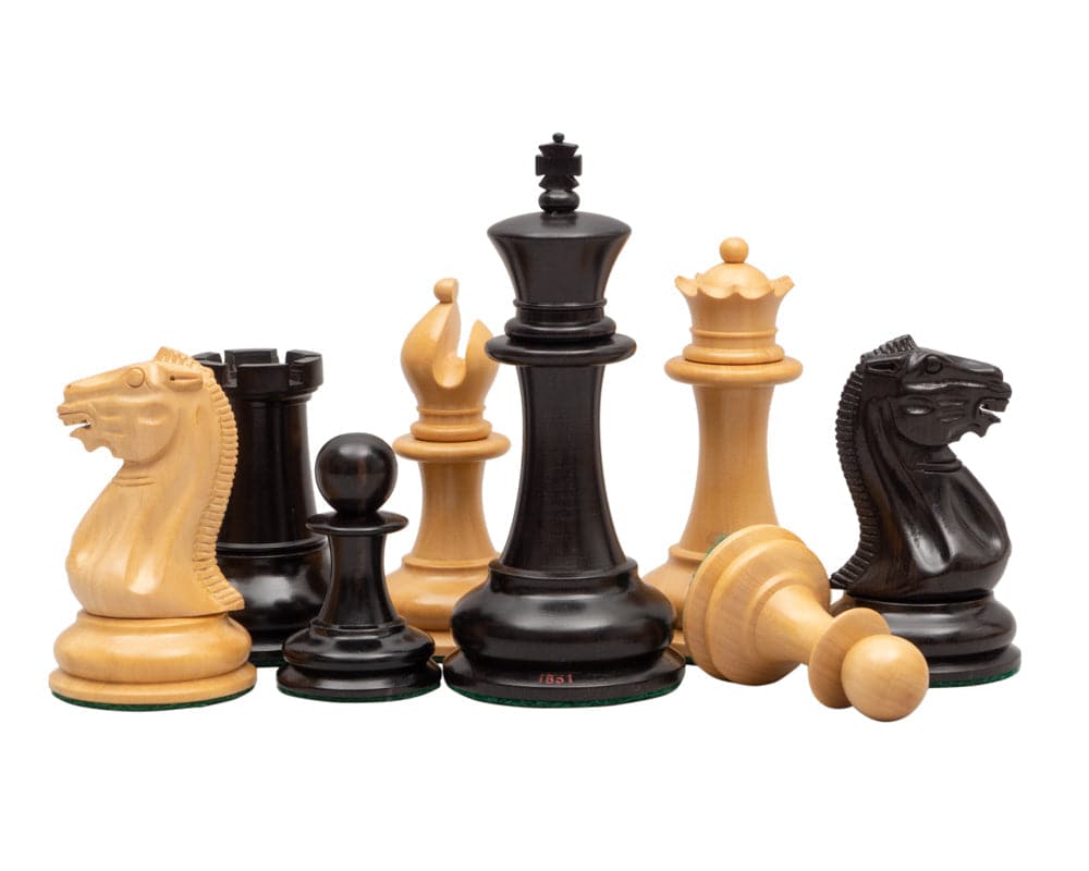 1851 reproduction Staunton ebony chessmen set with 4.4 inch king, broad bases, in black and boxwood, showcasing luxurious design and craftsmanship.