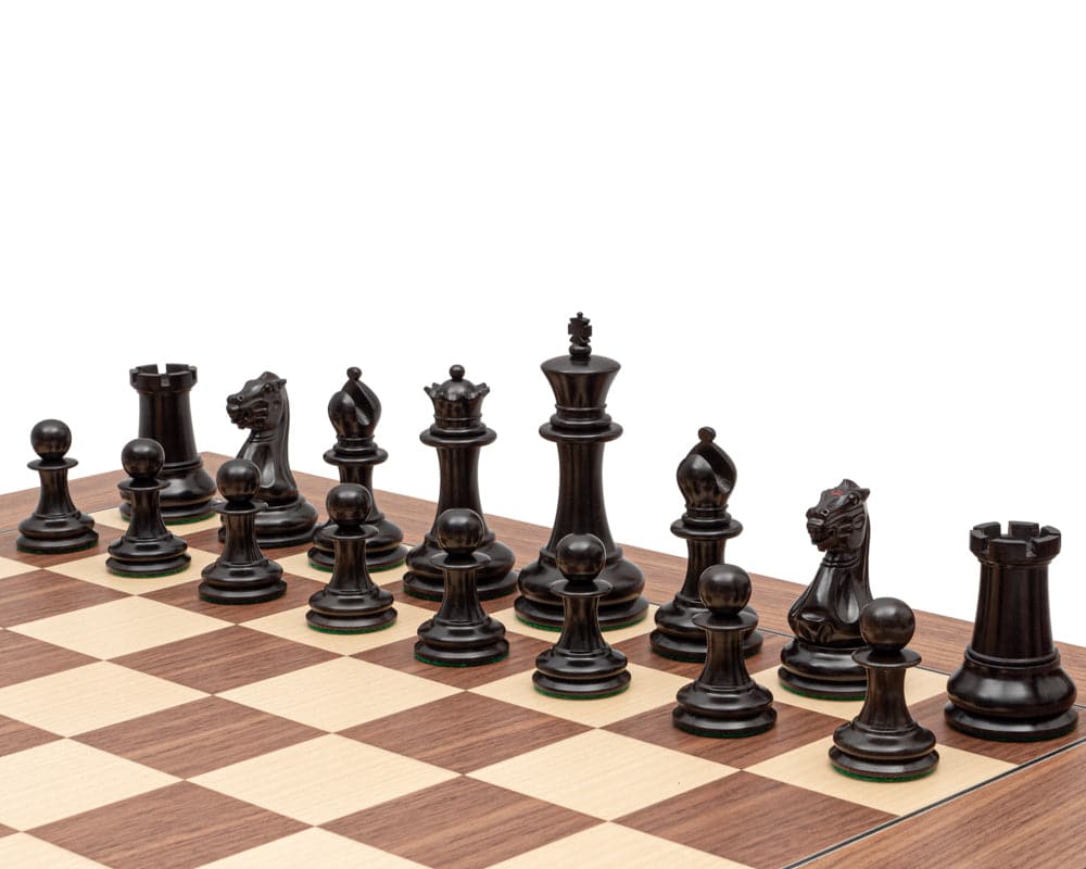 1851 Reproduction Staunton Ebony Chessmen on chessboard, 4.4 inch king, broad bases, classic Staunton design, beautifully crafted from ebony