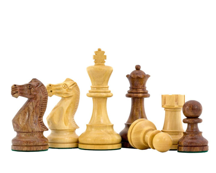 The Rochester Ebony Chessmen 4 inch Staunton design weighted chess pieces on display with 4 inch king and additional queens.