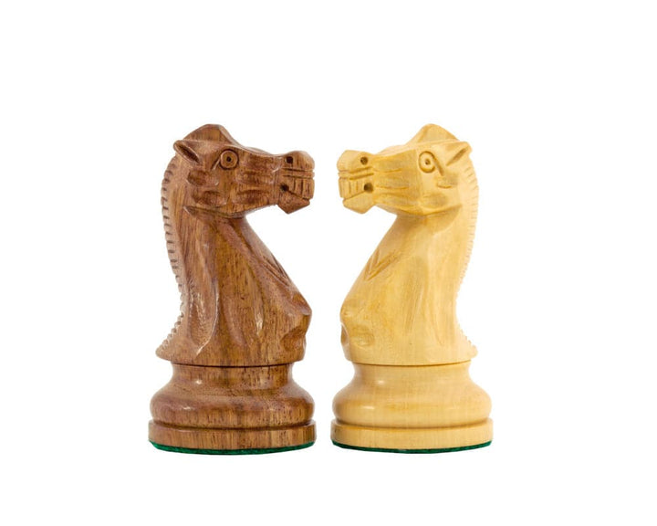 Two expertly crafted Rochester Ebony Chessmen knights with intricate detailing, one in dark wood and one in light wood.