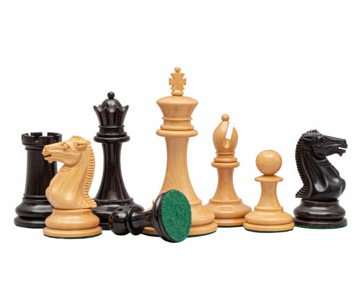 The Rochester Ebony Chessmen 4 inch Staunton design, featuring weighted pieces with billiard cloth bases and certificate of authenticity.