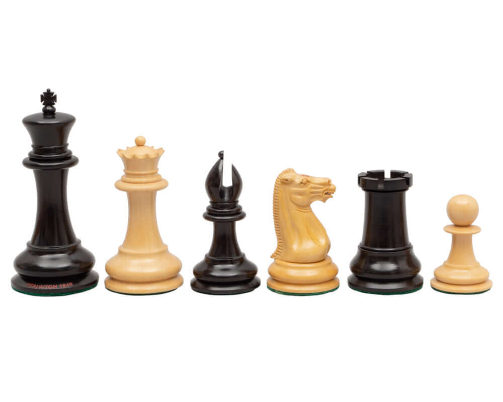 Original Staunton 1849 Ebony Chess Men 4.4 inch pieces featuring intricately detailed king, queen, bishop, knight, rook, and pawn.