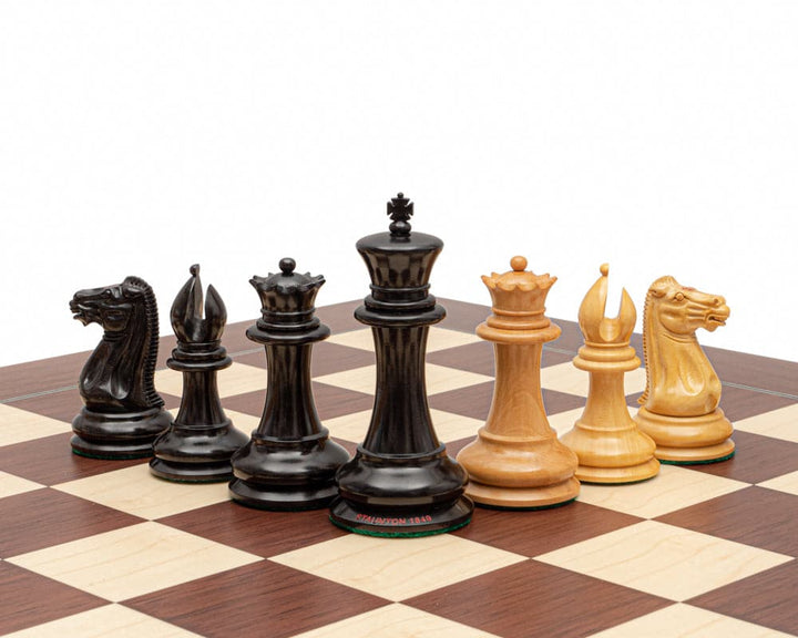 Original Staunton 1849 Ebony Chess Men with 4.4 inch king and broad bases on chessboard