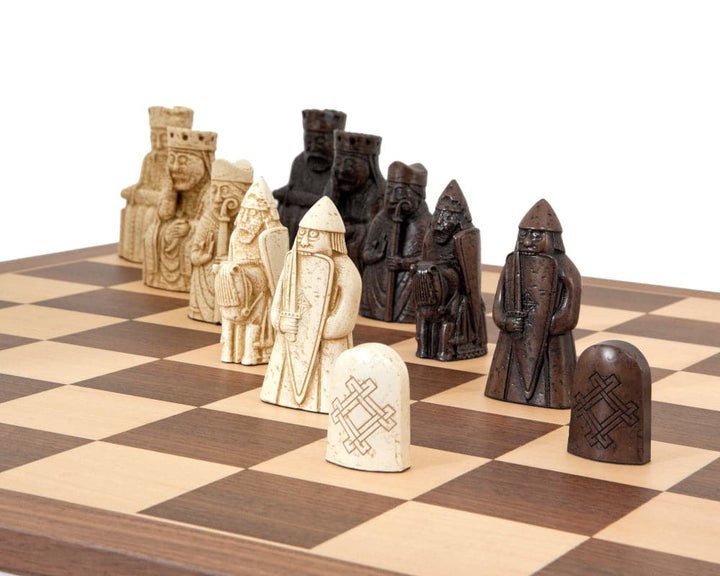 The Isle of Lewis Walnut and Maple Chess Set with hand-crafted chessmen inspired by historical designs, displayed on an elegant chessboard.