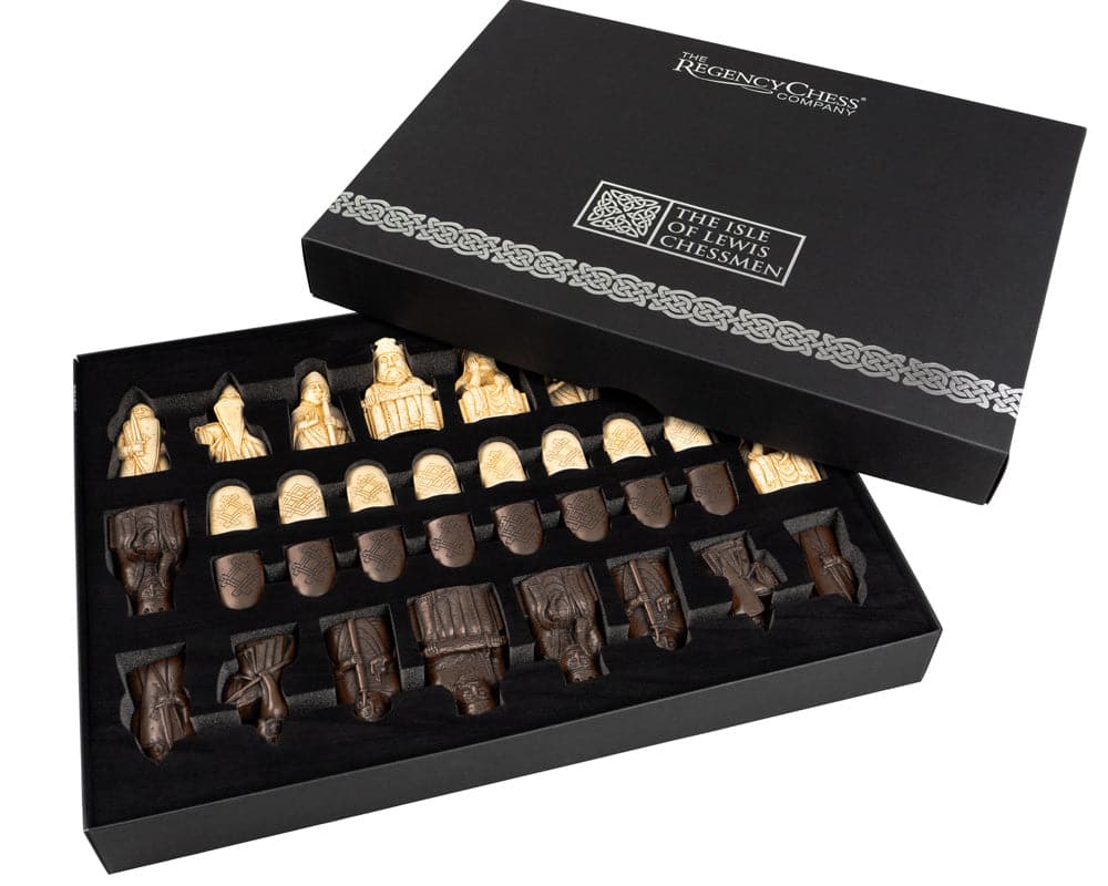 The Isle of Lewis Walnut and Maple Chess Set with handcrafted chessmen in an open black storage box.