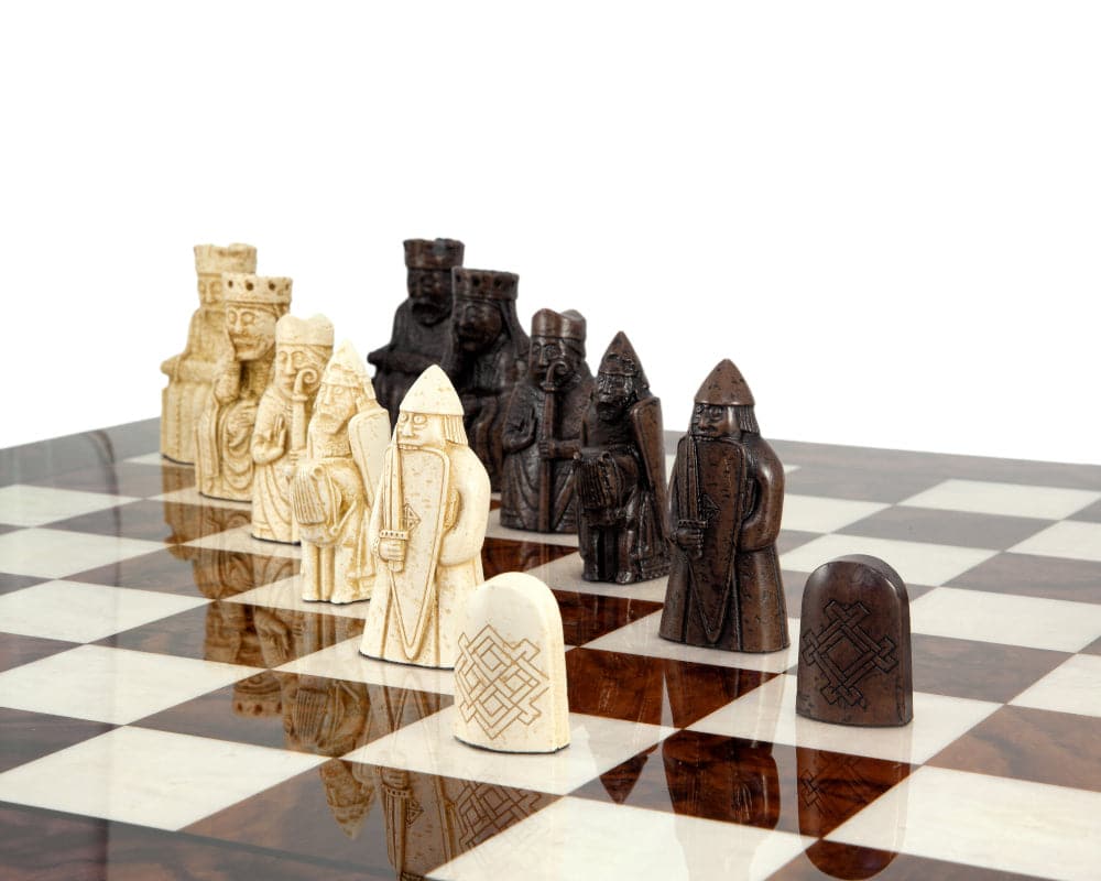 Isle of Lewis chessmen on Italian Briarwood chess board, luxury chess set replicating famous museum pieces.