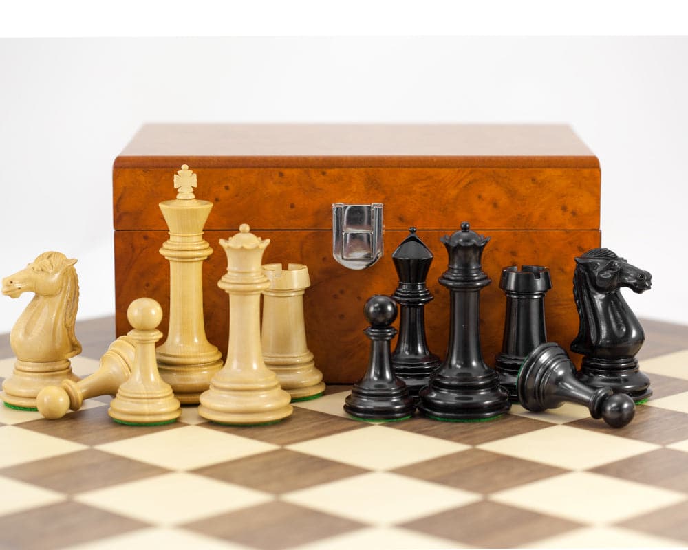 Parthenon Grand Ebony and Walnut Chess Set with 4.5 inch King and Luxury Boxwood Chessboard in the background