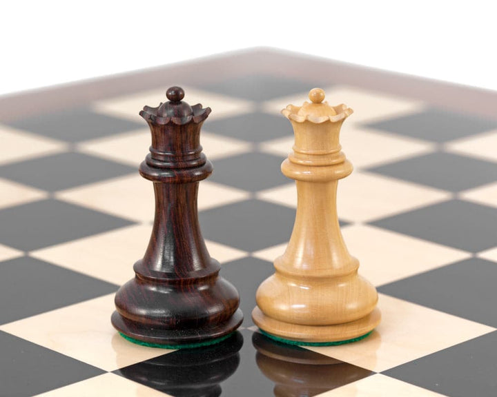 Rosewood and boxwood queens on high gloss Sandringham Grand Rosewood chess board.