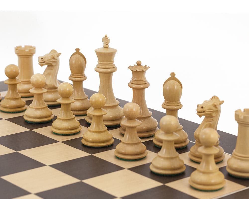 Handcrafted Staunton chess pieces set up on a deluxe wenge board, featuring a classic design and perfect balance.