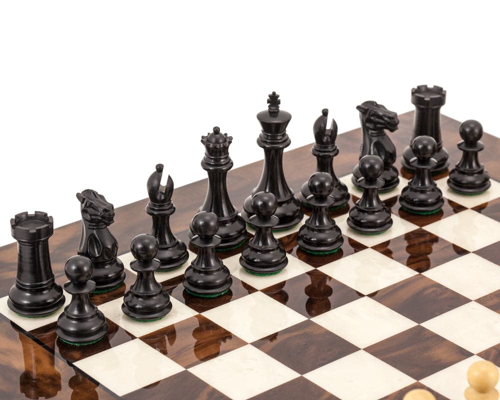 Highclere Ebony and Walnut Luxury Chess Set with classic Staunton design and impeccable quality. Displayed on an Italian wooden chess board.