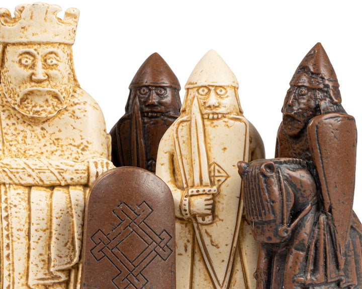 Isle of Lewis chess pieces replicas crafted with laser scanning technology on a tiger ebony and maple chess board.