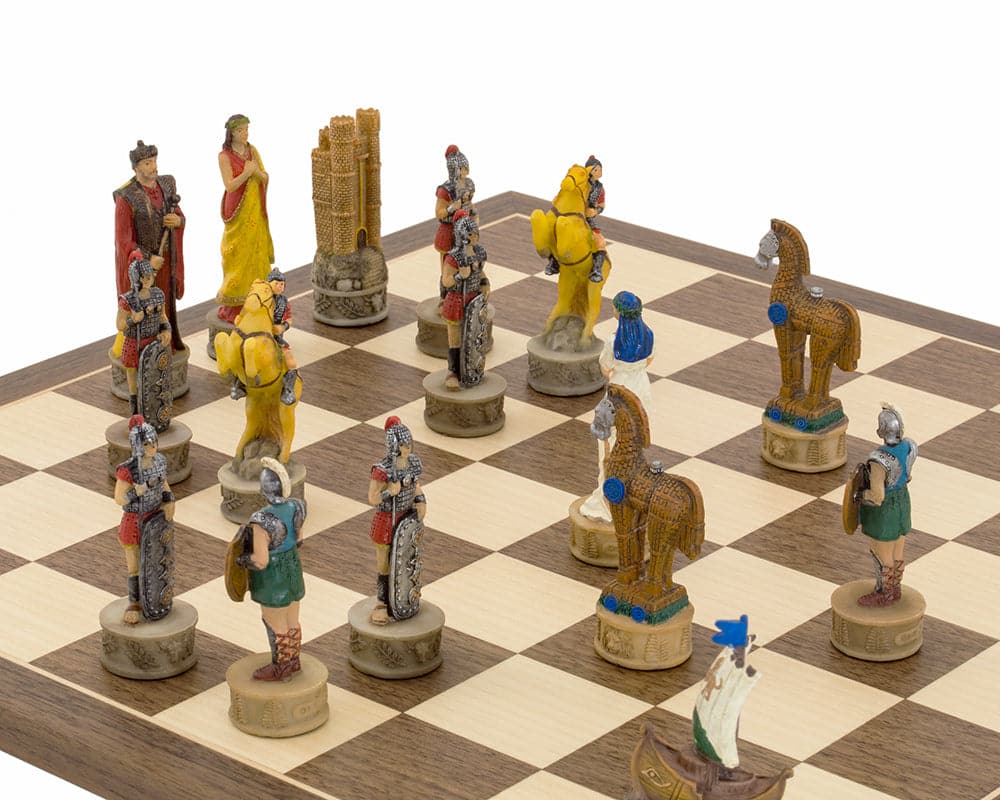 Hand-painted Battle of Troy chess set with detailed chessmen on a wooden board.