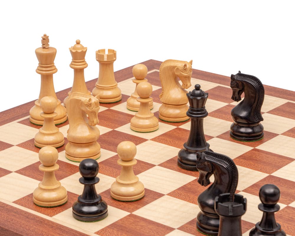 The Leningrad Mahogany Chess Set with ebonised boxwood pieces on a 19-inch Spanish board featuring 1.9 inch playing squares.