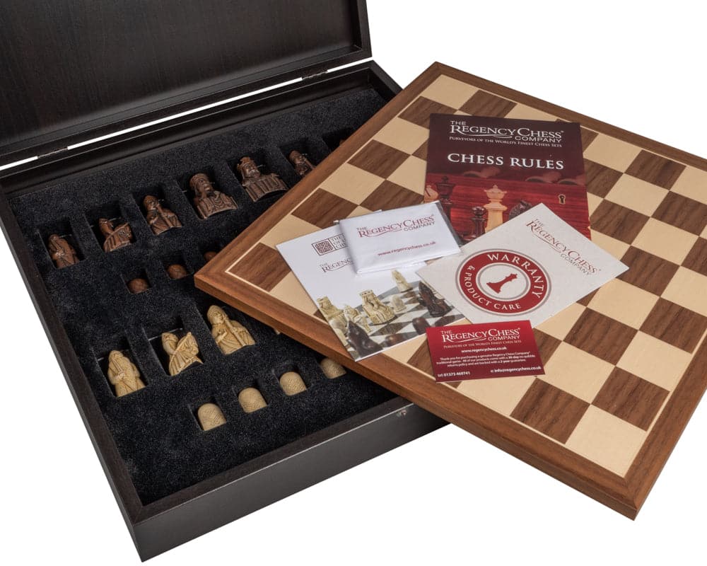 The Isle of Lewis and Walnut Deluxe Chess Set with presentation box, showing chess pieces, rules booklet, and elegant Walnut chess board