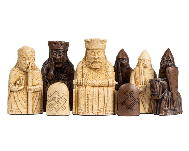 Close-up of Isle of Lewis chessmen included in Walnut Deluxe Chess Set with intricate detailing.