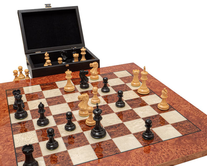 The Highgrove Ebony and Briarwood Luxury Chess Set on a high-grade Briarwood and Elm board with intricately carved pieces and open storage box.